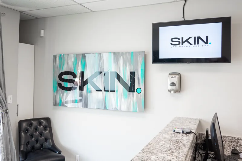 SKIN Las Vegas branded wall art in the waiting area